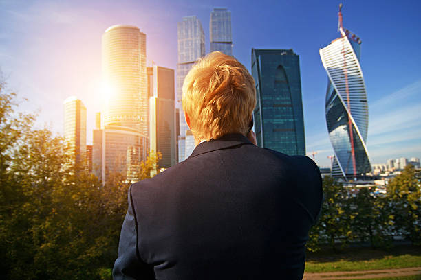istock man in jacket talking on the phone 537487443