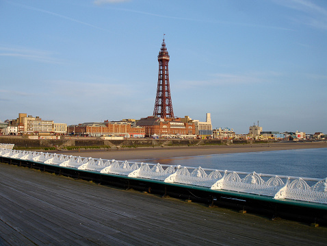 Blackpool Tower in Lancashire, UK, with Victorian detail of North Pier in the foreground