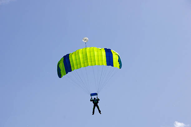 istock Parachutist jumping on a background of blue sky 537491211