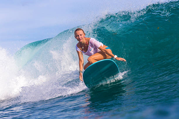 istock Surfer girl on Amazing Blue Wave 537491543