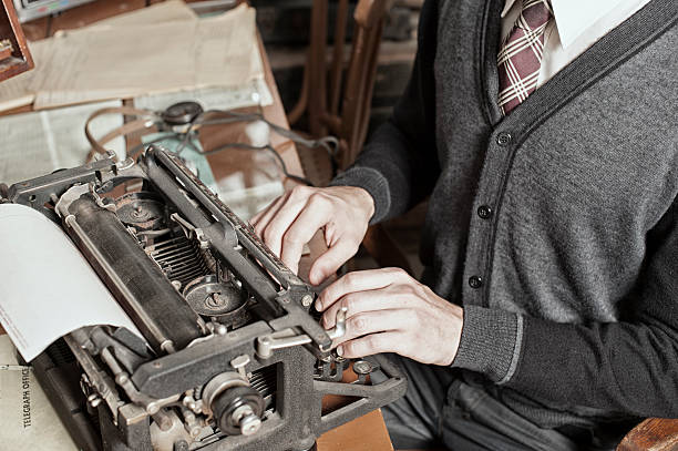 istock Male Typist on an Antique Typewriter in a Telegraph Office. 537498029