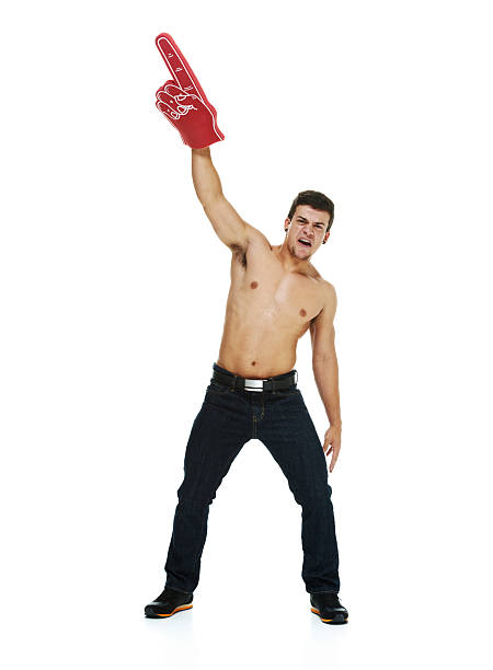 istock Shirtless man cheering with foam finger 537499663