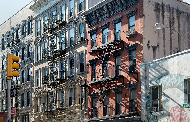 istock Red and white apartment buildings fire escapes 537499721