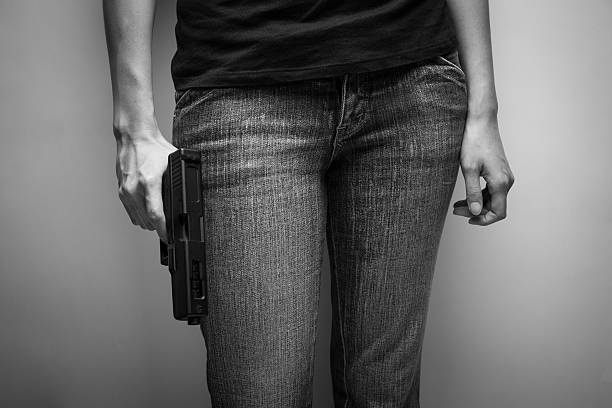 istock Girl Officer Concealing Weapon 537499795