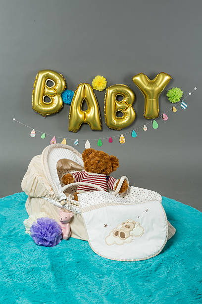 istock wicker Cot with flower and bear 537499931