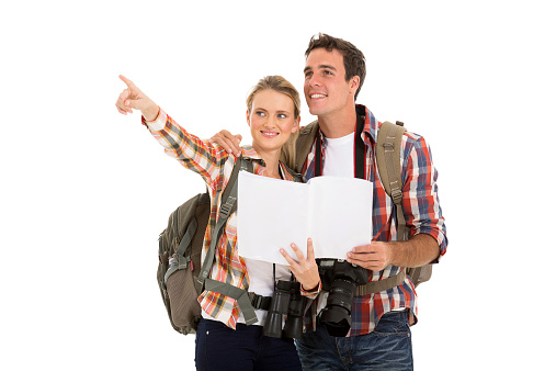 couple with backpacks and map