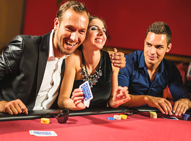 istock Friends playing at poker at Casino 537501777