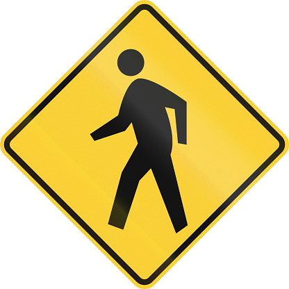 US road warning sign: Pedestrian crossing