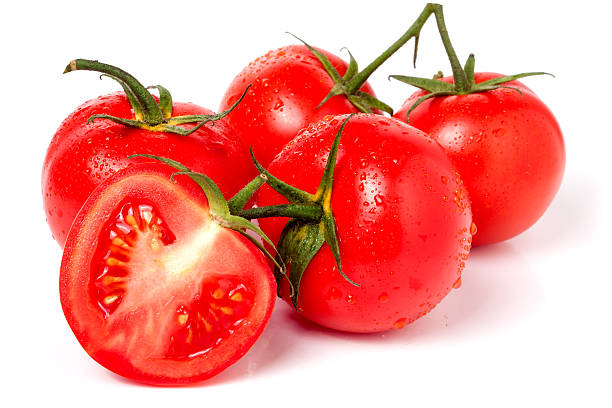 istock four tomatoes and half with water droplets isolated white background 537507974