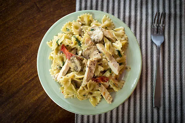 Chicken farfalle alfredo with mushrooms and sundried tomatoes
