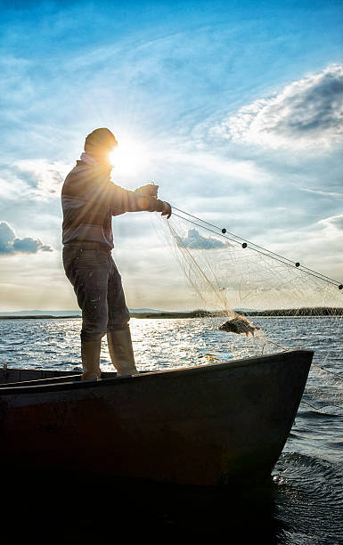 anziano pescatore sulla sua barca - turkish culture turkey fishing boat fishing foto e immagini stock