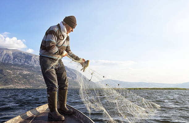 istock Old Fisherman on His Boat 537510826