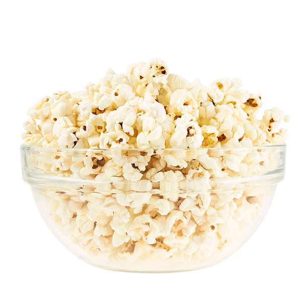 istock Glass bowl full of popcorn isolated 537510962
