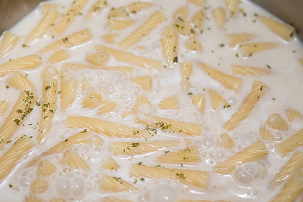 istock cooking italian pasta with cheese sauce at home 537512820