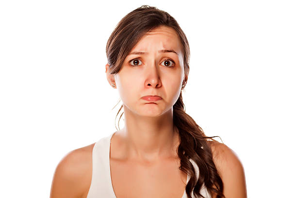istock Confused young woman posing on a white background 537513347