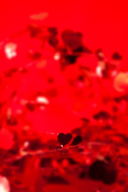 istock Valentine's Day background. Red hearts, confetti streamers. Tinsel. 537513525