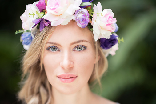 Very natural Beauty Portrait of a gorgeous Woman with Flowers in her Hair. Converted from RAW. Nikon D810.