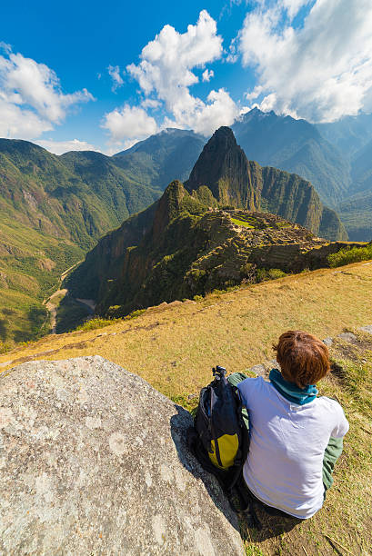 istock Tourist looking at Machu Picchu from above, Peru 537514422