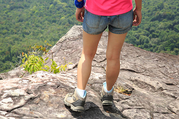 istock hiking woman on mountain peak 537515355