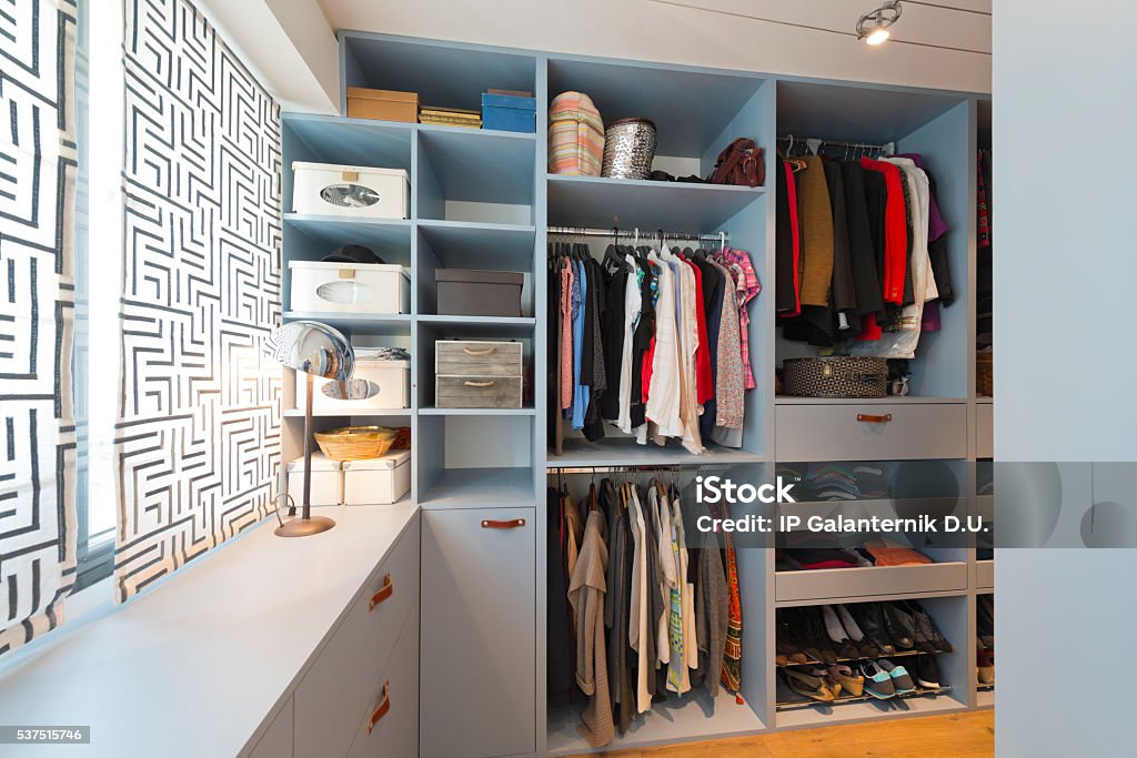 Big beautiful walk in wardrobe. Luxury modern home Closet Stock Photo