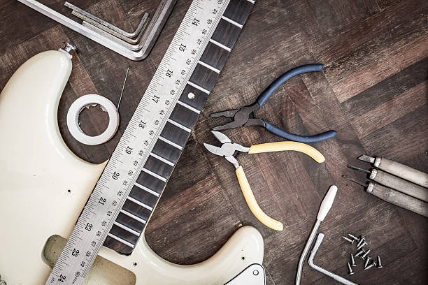 guitar on wood in repair & guitar maker luthier workshop stock photo