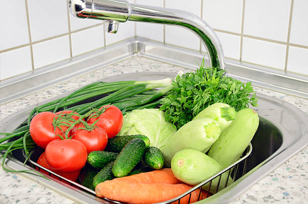 istock vegetables in the sink under tap 537519137