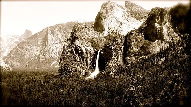 Archival, old photo of Bridalveil Falls and Half-Dome, Yosemite National Park.