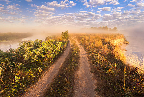 istock misty morning on the river and clouds reflected in water 537520039