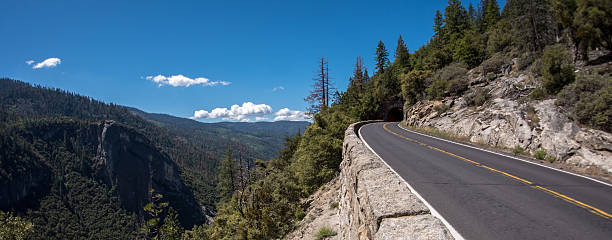 istock Panoramic of road going into mountain tunnel 537520854