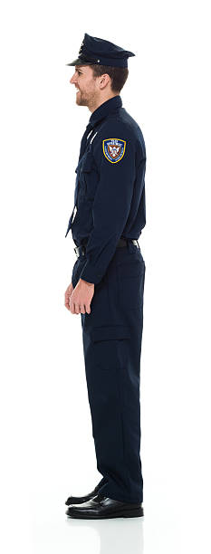 istock Smiling police standing and looking away 537521036