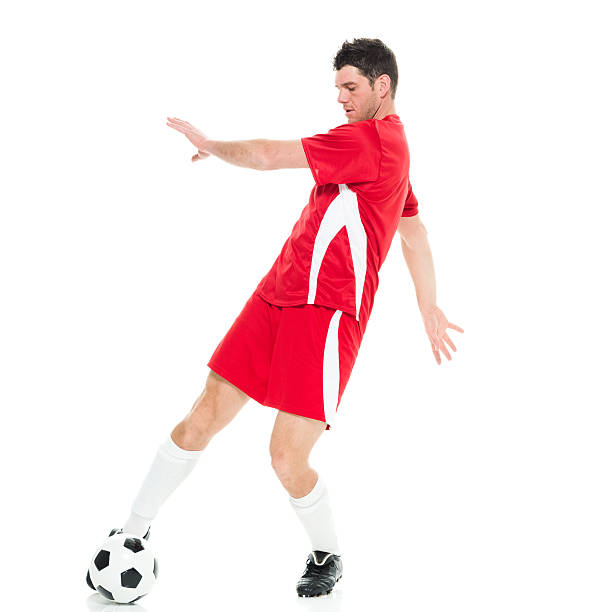 istock Soccer player kicking the ball 537523336
