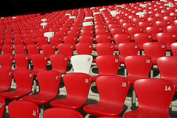 istock Red Tribune Seats in a stadium 537524056