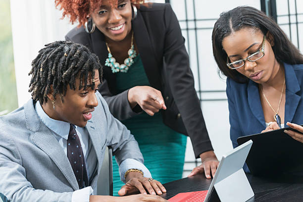 istock Three young African Americans in a business meeting 537526958