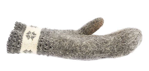 istock Old gray frayed mitten isolated 537528374