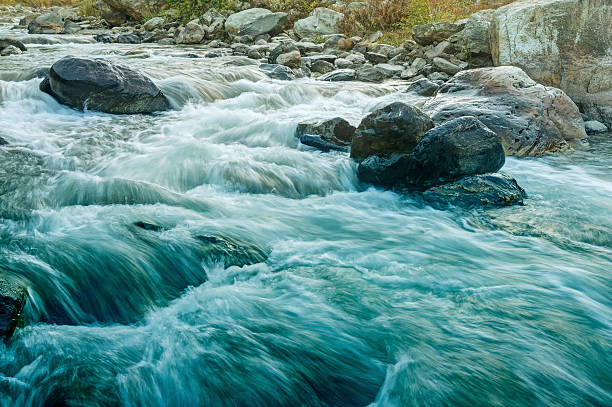 istock River water flowing through rocks at dawn 537529110