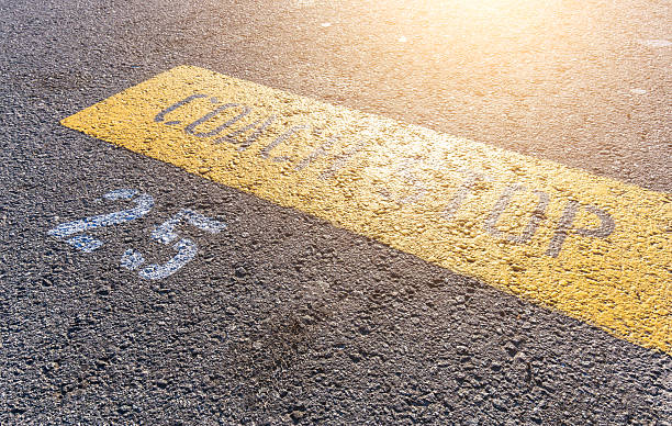 istock sign with coach stop on asphalt road in ligh 537530546
