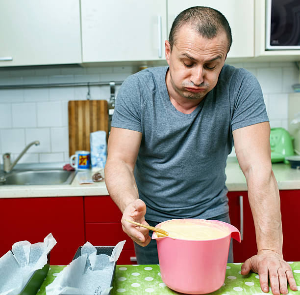 Angry cook having spoiled a dessert recipe