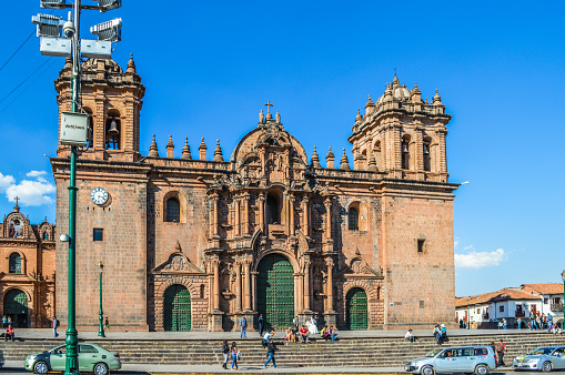 Cusco, Peru - August 22, 2014: Plaza de Armas, the town center of the city of Cuzco, Peru. Photo taken during the day and contains locals and tourists walking around the busy square.