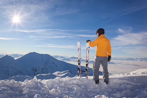 Taking a break from skiing to look at the mountains on a sunny day