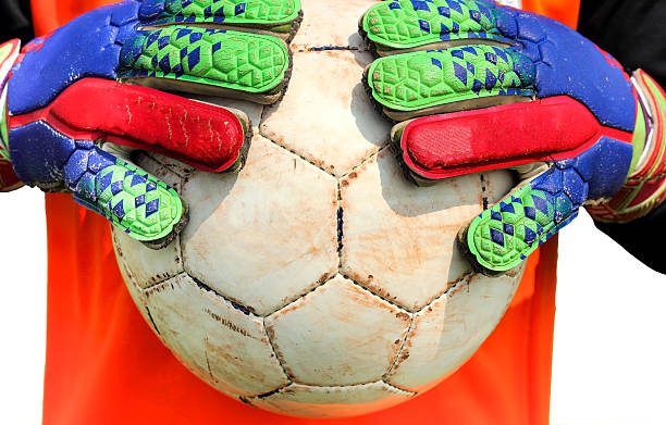 istock soccer goalkeeper catching ball on hands 537533707