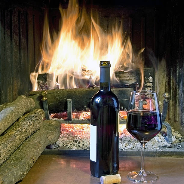 istock glass  wine in front of a fireplace 537534967