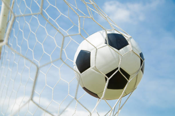 istock Soccer ball in the goal after shooted 537535755