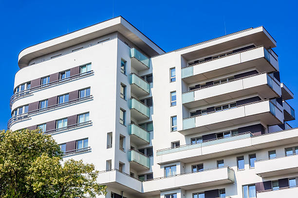 istock White apartment building against blue skies 537535824