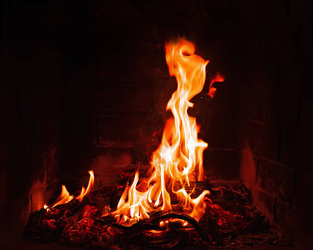 istock Fireplace burning. Warm burning and glowing fire in fireplace. 537536061