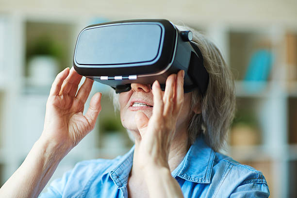 istock Senior female in vr headset 537536198