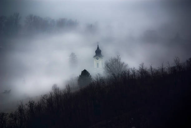 istock Foggy autumn landscape with a church 537536403