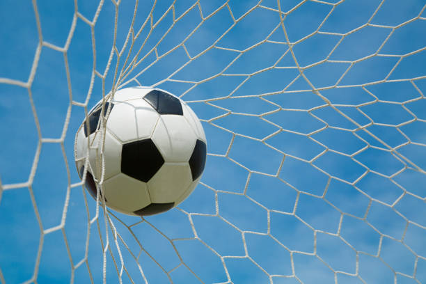 istock Soccer ball in the goal after shooted 537536465