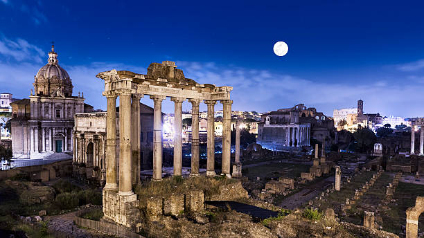 The famous Roman Forum at night with moon stock photo