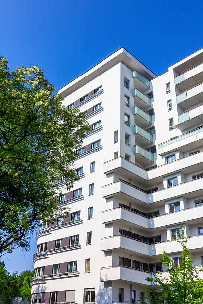 istock White apartment building against blue skies 537537780