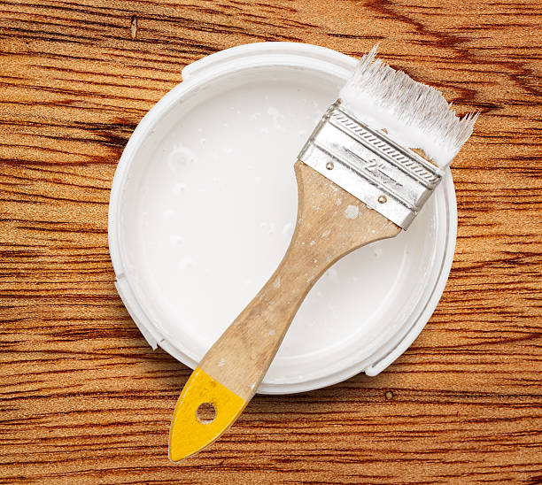 istock Can of white paint with brush 537538500